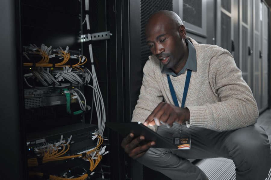 data-center-or-black-man-on-tablet-in-server-room-2025-04-06-07-10-33-utc